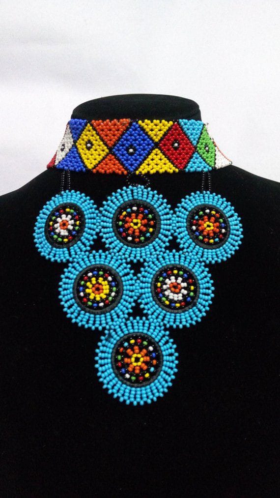 Multicolor choker beaded necklace with blue pendants.