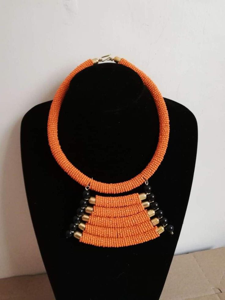 Layered pendant necklace; Orange Zulu necklace