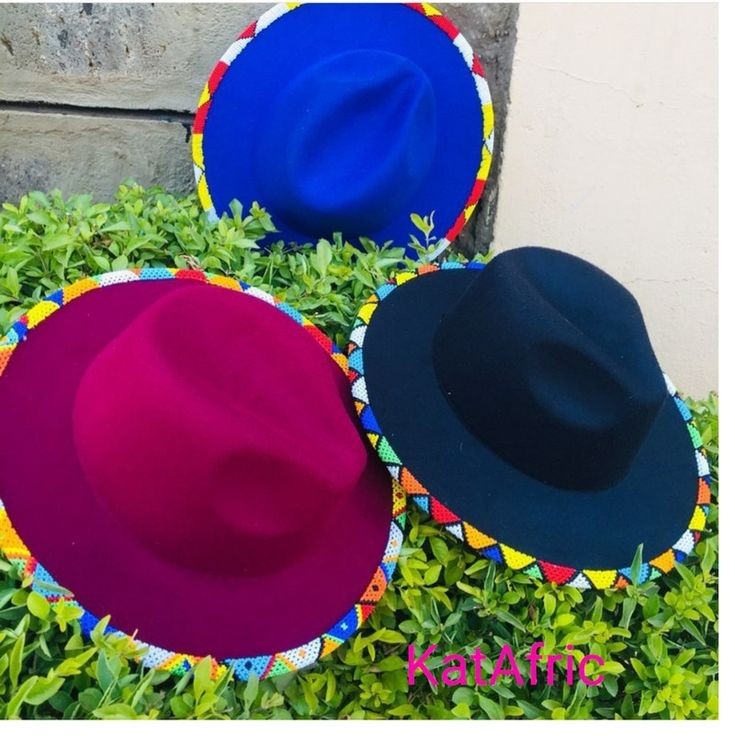 3 fedora hats decorated with colorful beads